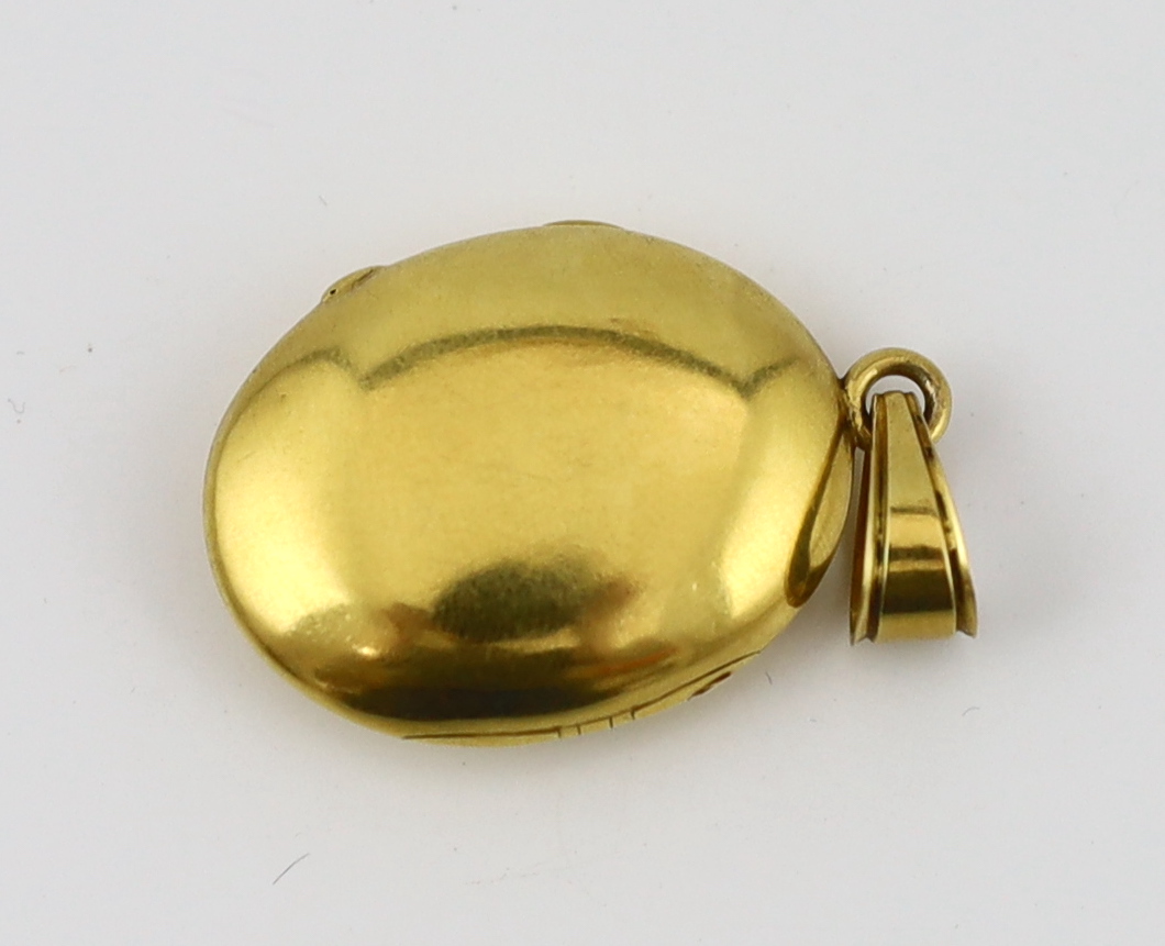 A Victorian gold, enamel and rose cut diamond set oval locket